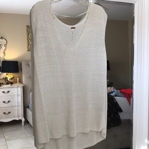 White Free People short sleeved sweater.
